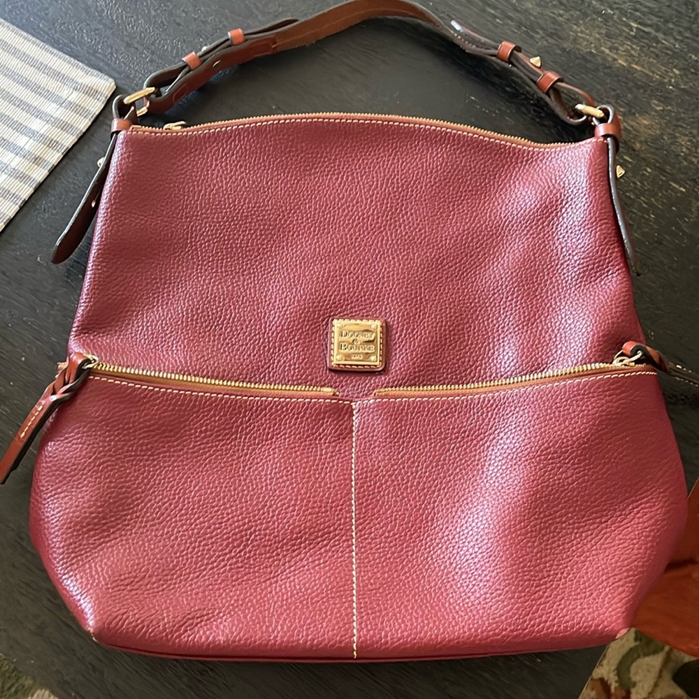 Dooney & Bourke shoulder purse. Burgundy colored. Like new.
